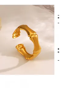Macro shot of gold bamboo knuckle structure on an adjustable stainless steel ring