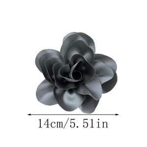 Detail showing a 14cm dark grey satin floral brooch with 3D layered fabric petals