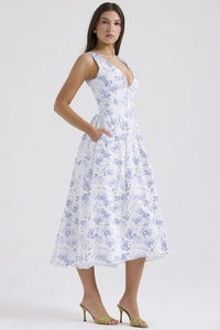 Detail view of V-neck floral midi dress in white and blue cotton linen blend fabric