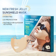 Detail view of hydrating sunshield jelly mask with 360-minute UV protection on beach backdrop