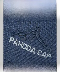 Close-up of PAHODA mountain embroidery and twill texture on a navy blue baseball cap