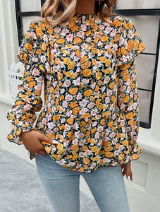 Detail of yellow floral long sleeve shirt with ruffle high neck and babydoll fit style