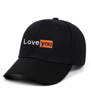 Detail of embroidered 'Love you' text on black washed cotton baseball cap texture