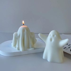 Ghost Halloween scented candle set with two white funny spooky figures on a tray
