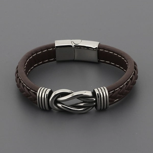 Men's braided brown leather bracelet with polished metal knot and magnetic buckle