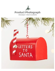 Red retro metal Santa letter mailbox hanging decoration on green Christmas pine branch