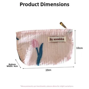 Pink embossed floral makeup bag with tulip embroidery and detailed size measurements