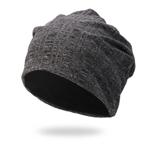 Close-up of a premium dark grey vertical ribbed knitted beanie for outdoor winter warmth