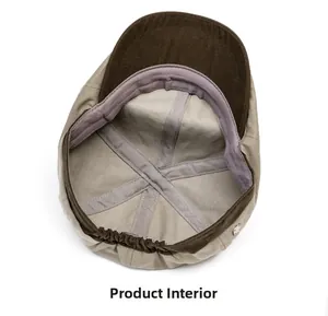 Detail view of khaki flat cap interior featuring cross-stitching and elastic strap