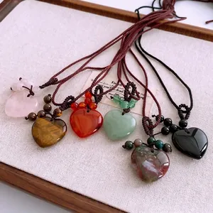 Woven cord necklaces with heart-shaped gemstone pendants in rose quartz and tiger eye stones