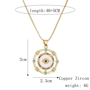 Detail view of gold Evil Eye heart pendant with colorful zircons and size specifications