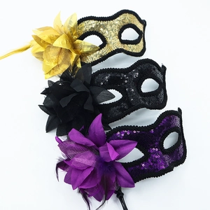 Masquerade masks with sequins, feathers and floral accents in gold, black and purple