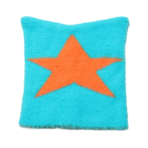 Close-up of plush knit fabric with star pattern showing soft texture and detailed weave