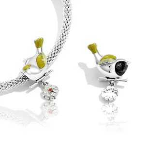 S925 sterling silver colorful bird charm with yellow enamel wings and flower dangle