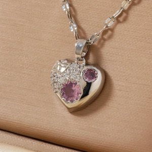 Elegant heart pendant necklace with pink flower zircon on champagne silk background