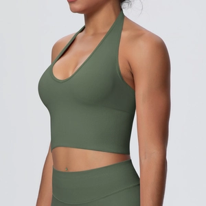 Detail of olive green halter sports bra showing seamless knit and ribbed texture