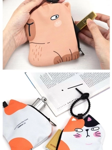 Detail of portable cartoon animal coin purse showing zipper closure and soft material