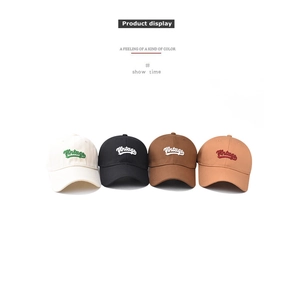 Detail showing four vintage cotton baseball caps with 3D embroidery on a white background