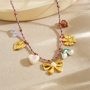 Bohemian woven rope necklace with rainbow, leaf, and bow ceramic pendant charms