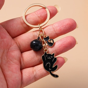 Cute black cat keychain set with gold metal ring and matching black bell accessory