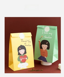 Detail of cartoon teacher appreciation gift bags with round Thank You sealing stickers