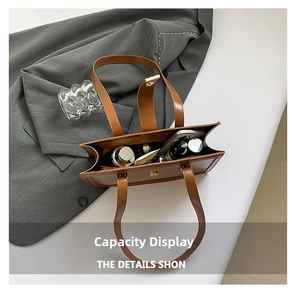 Interior view showing the large storage capacity of the brown faux leather tote bag
