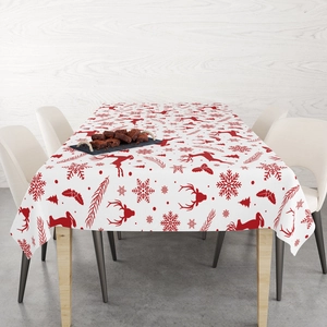 Macro detail of red Christmas reindeer and snowflake prints on a thick cotton tablecloth