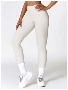 Detail view of high waisted brushed yoga leggings in light grey with seamless finish
