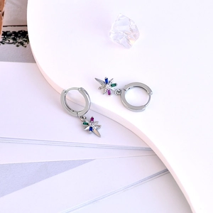 Detailed view of silver star earrings featuring multi-colored cubic zirconia inlays