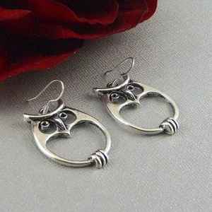 Vintage hollow owl earrings in antique silver finish with boho fish hook design
