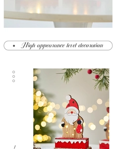 Close-up of wooden Santa Claus desktop decor with warm light and hollow design details