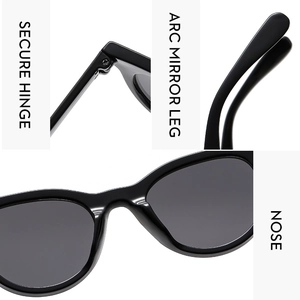 Detail view of reinforced hinges and non-slip curved legs on black fashion sunglasses