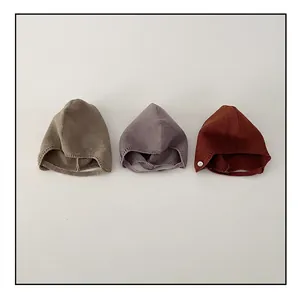 Minimalist knit baby earflap hats in khaki, grey-purple, and caramel on white background