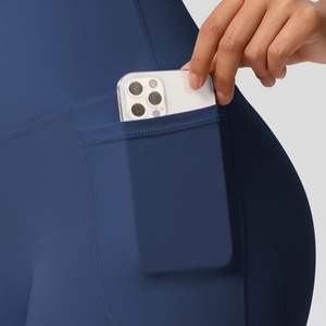 Detail view of high waist yoga shorts featuring side pocket for smartphone storage