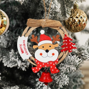 Wooden reindeer Christmas wreath with red bells and Merry Christmas sign on a tree