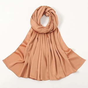 Elegant apricot bubble satin hijab wrap for women with soft silky drape and pleated texture