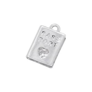Detailed close-up of a silver passport pendant with heart gemstone and PASSPORT engraving