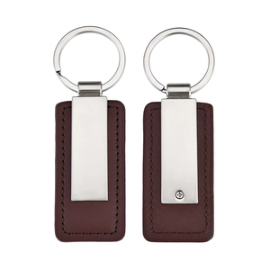 Front and back view of a dark brown leather keychain with silver rectangular metal plate
