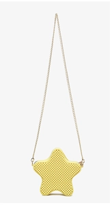 Detail of yellow star-shaped PVC jelly bag with metallic chain and grainy texture