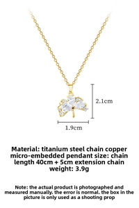 Macro view of golden butterfly pendant with dimensions showing 2.1cm by 1.9cm size