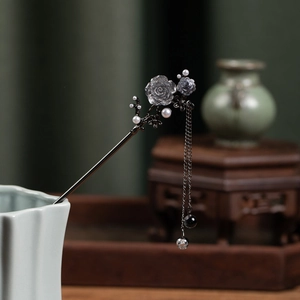 Detail of vintage hair stick with translucent flowers pearl tassels and black alloy pin