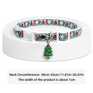 Christmas pet collar with green white pattern and holiday tree charm on white base