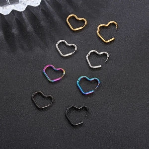 Detailed view of heart-shaped hoop earrings in gold, silver, rainbow, and black finishes
