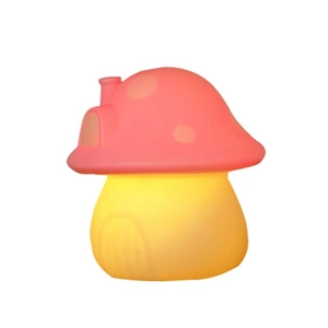 Cute pink mushroom night light with white dots on a warm glowing yellow base
