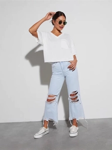 Jeans vintage da donna a gamba larga con strappi alle ginocchia e orli sfilacciati blu