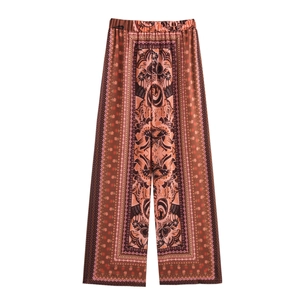 Flat lay of high-waist wide-leg pants featuring retro bohemian print and elastic waistband