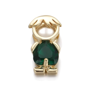 Macro shot of stylized boy pendant featuring a large green heart-shaped zircon gemstone