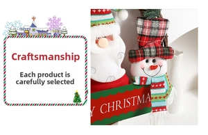 Close-up of Santa Claus and snowman plush dolls on a rustic Christmas grapevine wreath