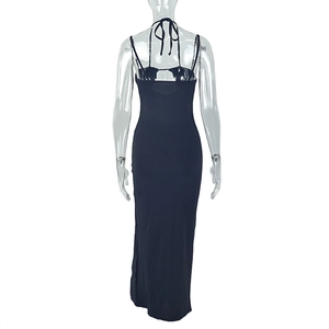 Detail of elegant black backless halter maxi dress with lace-up strappy back design