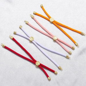 Adjustable woven cords in vibrant colors with tree pattern gold sliders for DIY jewelry